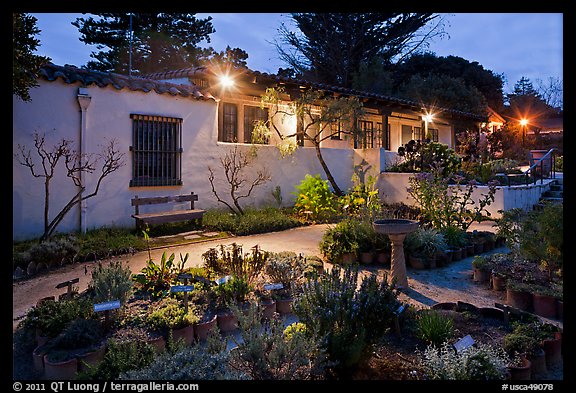 Garden and historic adobe house at night. Monterey, California, USA