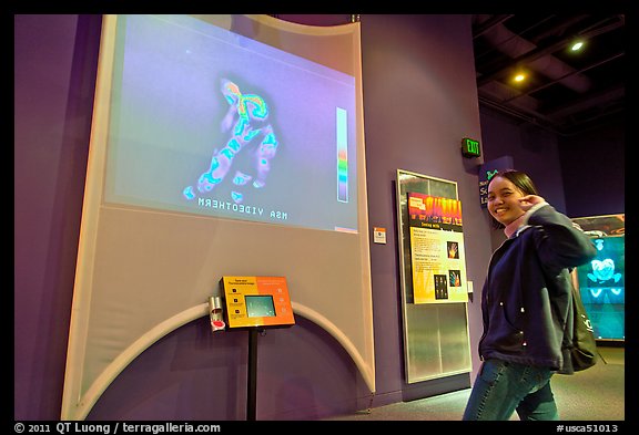 Woman imaged by thermal camera, Tech Museum. San Jose, California, USA (color)