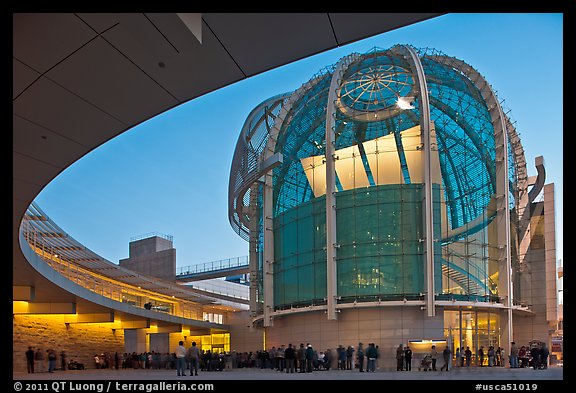 Crowd gathered around rotunda at dusk, San Jose City Hall. San Jose, California, USA