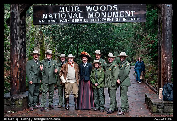 Rangers posing with Theodore Roosevelt under entrance gate. Muir Woods National Monument, California, USA (color)