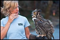 Owl perched on woman's arm, Alum Rock Park. San Jose, California, USA (color)