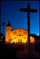 Cross and Santa Clara Mission at dusk. Santa Clara,  California, USA