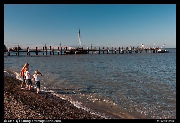 Girls on China Camp Beach near pier, China Camp State Park. San Pablo Bay, California, USA (color)