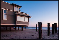 Pilings and beach house at sunset, Stinson Beach. California, USA (color)