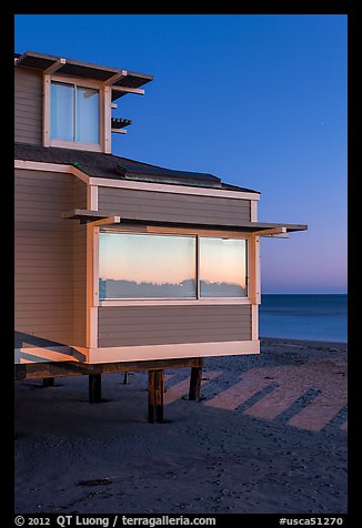 Contemporary beach house at dusk, sunset reflection, Stinson Beach. California, USA