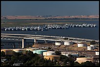 Oil tanks, Carquinez Strait, and mothball fleet. Martinez, California, USA (color)