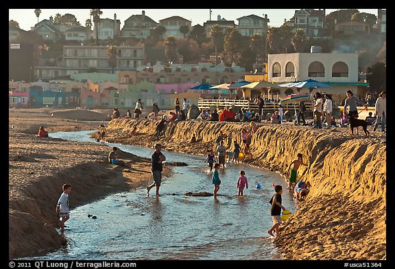 Children playing in tidal stream. Capitola, California, USA