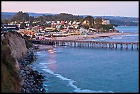 Cliff, Fishing Pier at sunset, and village. Capitola, California, USA (color)