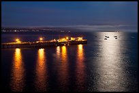 Pier and yachts with moon reflection. Capitola, California, USA