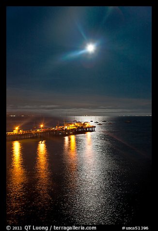 Moon and fishing pier by night. Capitola, California, USA