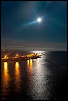 Moon and fishing pier by night. Capitola, California, USA