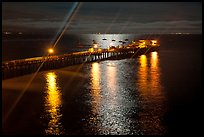 Wharf with moon reflections and light rays. Capitola, California, USA (color)