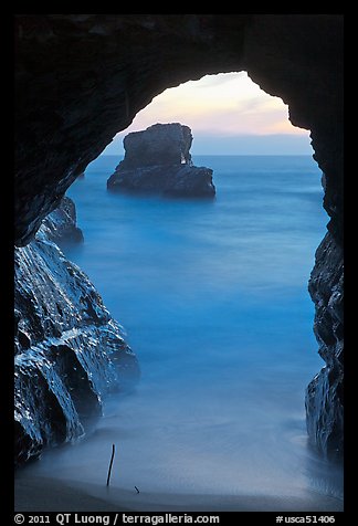 Ocean seen from sea arch at sunset, Davenport. California, USA