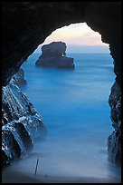 Ocean seen from sea arch at sunset, Davenport. California, USA