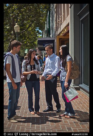 Group talking on University Avenue. Palo Alto,  California, USA (color)