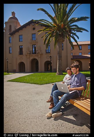 Students with laptop on bench. Stanford University, California, USA