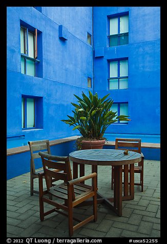 Tables and chairs in blue courtyard, Schwab Residential Center. Stanford University, California, USA