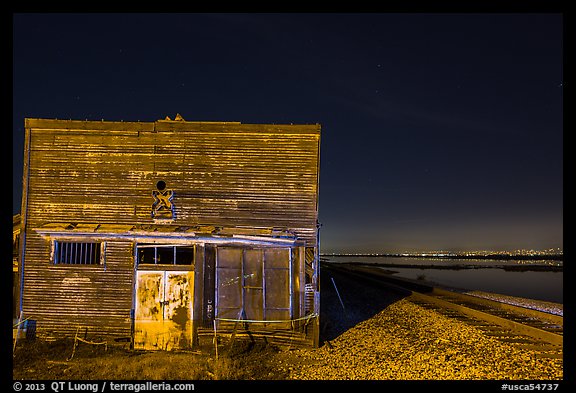 Shack, rails, and bay by night, Alviso. San Jose, California, USA