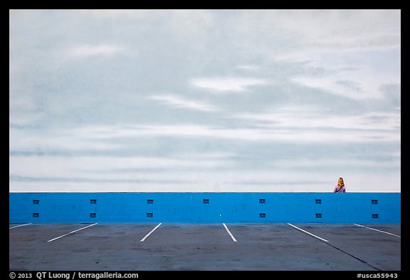 Woman looking at mural of sky and wispy clouds, Studios at Paramount. Hollywood, Los Angeles, California, USA (color)