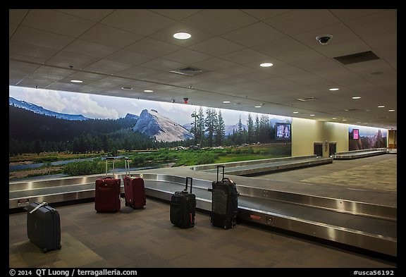 Baggage claim area and Yosemite murals, Fresno Yosemite Airport. California, USA (color)