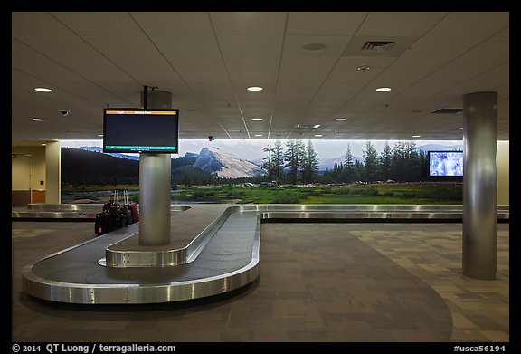 Baggage claim area and Tuolumne Meadows mural, Fresno Yosemite Airport. California, USA