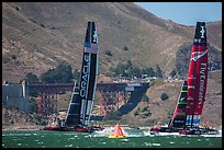 Emirates Team New Zealand leeward of Oracle Team USA at first mark. San Francisco, California, USA (color)