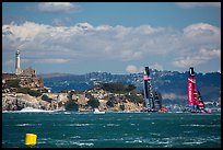 America's cup boats sail away at 40 knots from Alcatraz Island. San Francisco, California, USA (color)