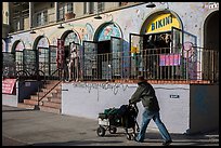 Man pushing cart in front of stores. Venice, Los Angeles, California, USA ( color)