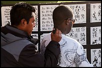 Man getting a tatoo. Venice, Los Angeles, California, USA ( color)