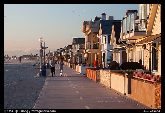People exercising on beachfront walkway. Newport Beach, Orange County, California, USA (color)