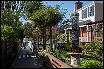 Man walking dogs in alley. Venice, Los Angeles, California, USA ( color)