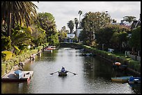 Woman rowing in canal. Venice, Los Angeles, California, USA ( color)