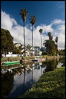 Houses, boats, and palm trees along canal. Venice, Los Angeles, California, USA ( color)