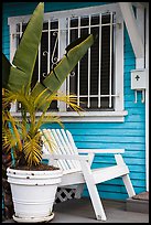 Matching white garden chair, flower pots, and window on porch. Venice, Los Angeles, California, USA ( color)