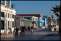 Riding bicycles on beachfront promenade, Hermosa Beach. Los Angeles, California, USA ( color)