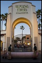 Men roll red carpet in front of Universal Studios gate. Universal City, Los Angeles, California, USA ( color)