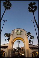 Entrance gate at dusk, Universal Studios. Universal City, Los Angeles, California, USA ( color)