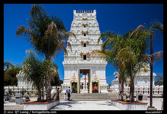 Family walks into Malibu Hindu Temple, Calabasas. Los Angeles, California, USA (color)