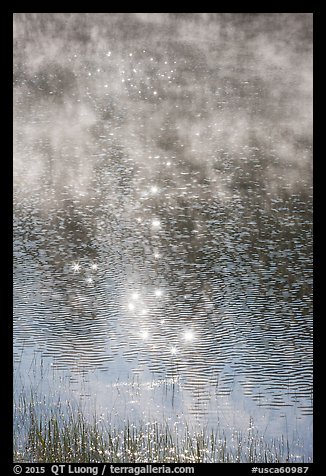 Water with sun highlights, ripples, and mist rising. California, USA