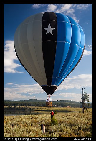 Hot air balloon low next to Prosser Reservoir, Tahoe National Forest. California, USA (color)