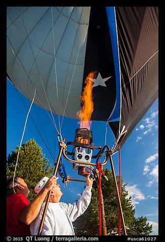 Pilot releases hot air into balloon, Tahoe National Forest. California, USA (color)