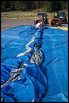 Hot air balloon being folded for transportation, Tahoe National Forest. California, USA ( color)