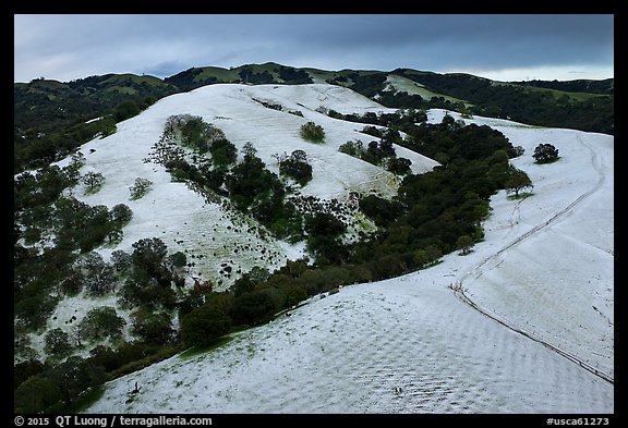 Aerial view of Evergreen Hills covered by hail. San Jose, California, USA (color)