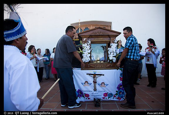 Men carrying Senor de los Milagros altar, Mission San Miguel. California, USA (color)