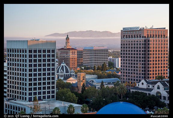 San Jose skyline at sunrise with fog over hills. San Jose, California, USA (color)