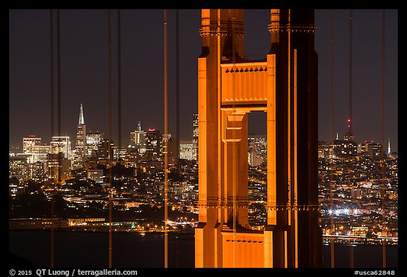 Golden Gate Bridge pillar and San Francisco skyline at night. San Francisco, California, USA (color)