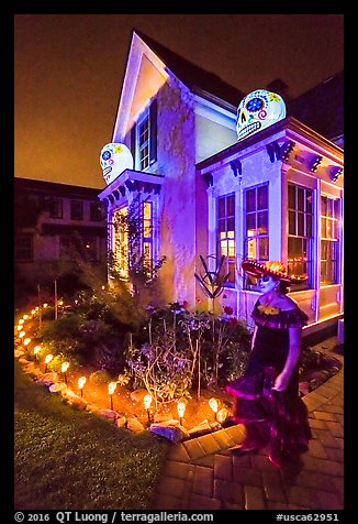 Woman in Halloween costume and decorated house. Petaluma, California, USA (color)