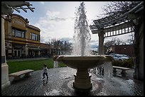 Fountain and plaza with child playing. Livermore, California, USA ( color)