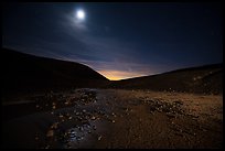 Moon shining inside Amboy Crater at night. Mojave Trails National Monument, California, USA ( color)