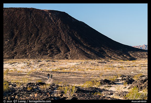 Hikers on Western Cone Trail, Amboy Crater. Mojave Trails National Monument, California, USA (color)